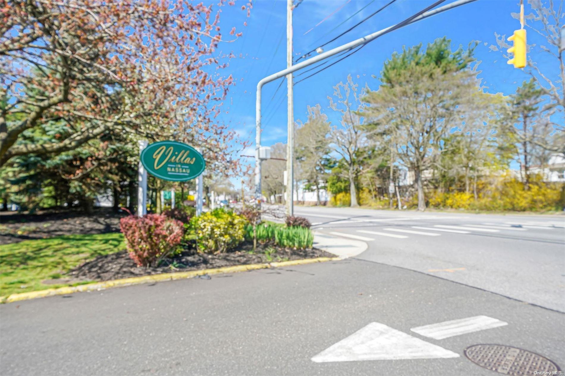 37 Santa Barbara Drive, Unit 37 Plainview, NY 11803 - Photo 27 of 32 a street sign on a side of building