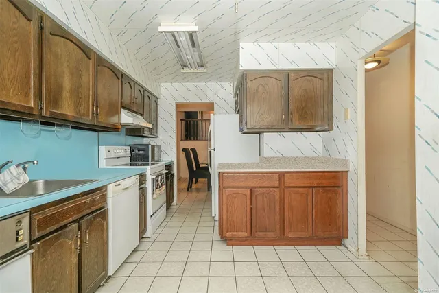 a kitchen with stainless steel appliances granite countertop a sink and cabinets