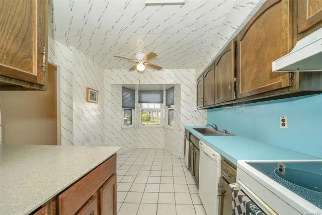 a view of a kitchen with a sink and dishwasher