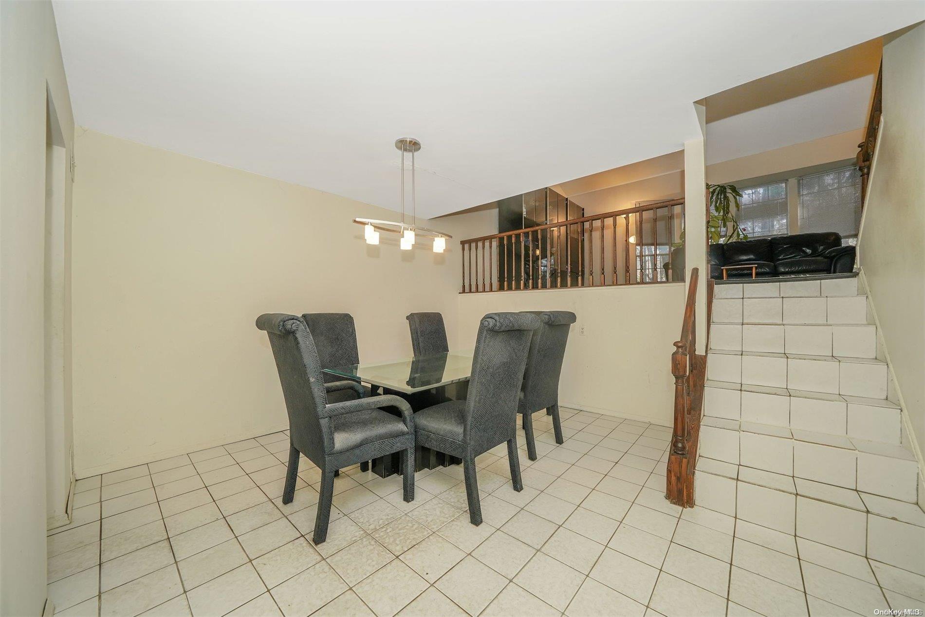 37 Santa Barbara Drive, Unit 37 Plainview, NY 11803 - Photo 9 of 32 a view of a dining room with furniture