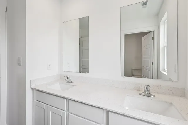 a bathroom with a bathtub and a toilet