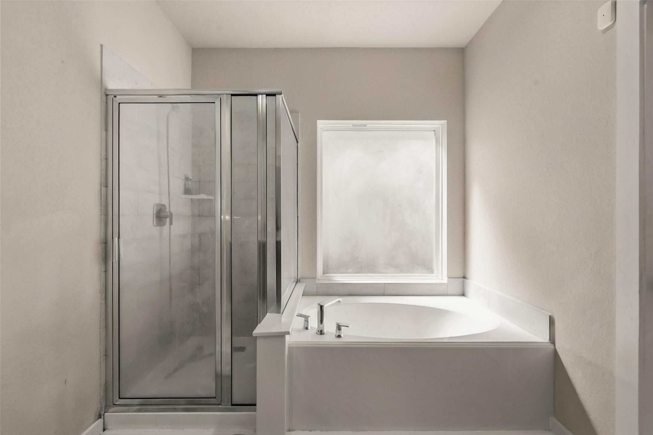 22939 Aspen Vista Dr Spring Spring, TX 77373 - Photo 12 of 29 Designed as a private retreat, the primary bath features a spacious walk in shower, relaxing soaking tub, and a bright, open layout filled with natural light.