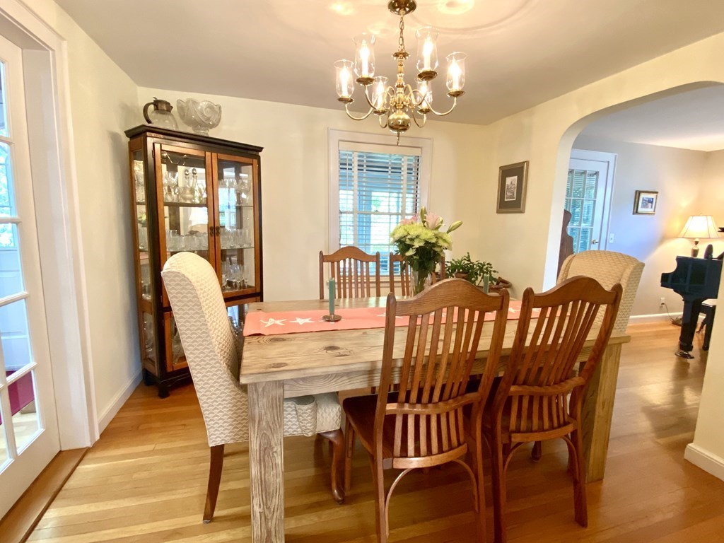 10 Duxbury Road Wellesley, MA 02481 - Photo 3 of 15 a view of a dining room with furniture wooden floor and chandelier