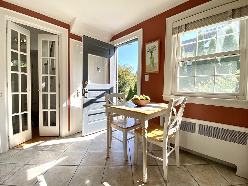 10 Duxbury Road Wellesley, MA 02481 - Photo 6 of 15 a dining room with furniture and large windows