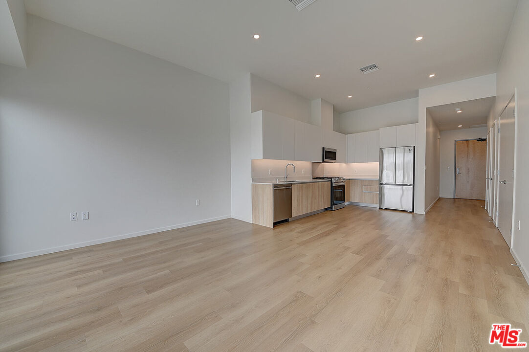 200 West Ocean Boulevard, Unit 711 Long Beach, CA 90802 - Photo 11 of 21 a view of kitchen with furniture and refrigerator