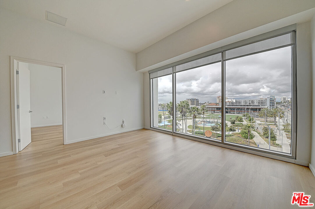200 West Ocean Boulevard, Unit 711 Long Beach, CA 90802 - Photo 9 of 21 wooden floor in an empty room with a window