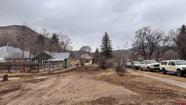 a view of street with parked cars
