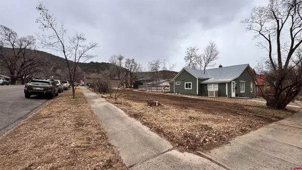 a view of a town with large trees