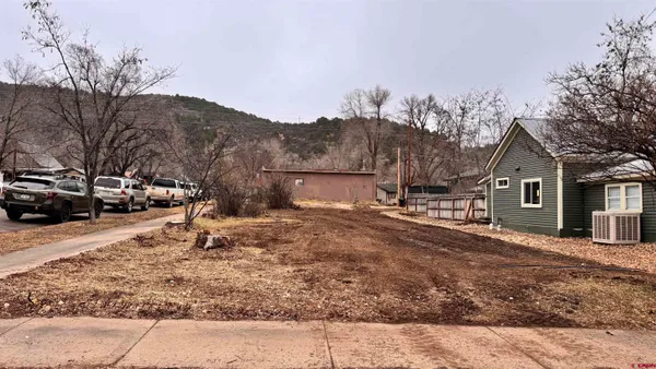 a view of a town with large trees
