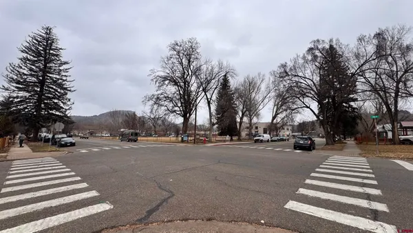 a view of road with card parked on road