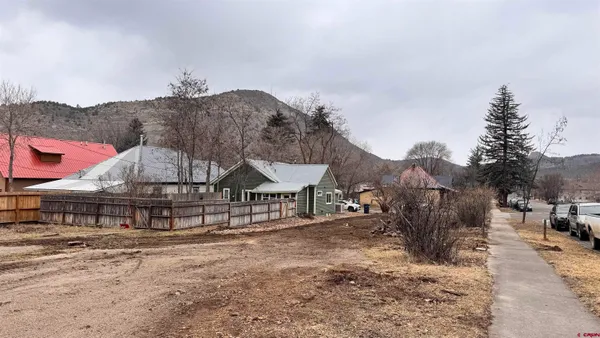 a view of a town with large trees
