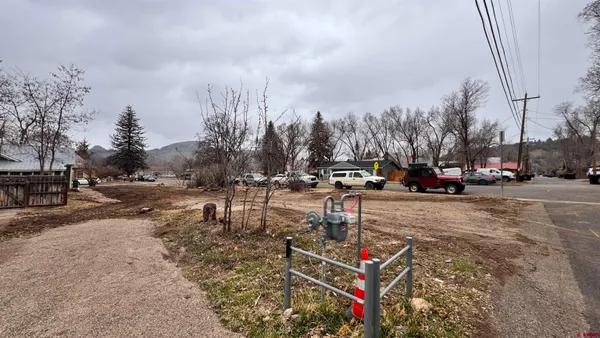 a view of a park with swings and slides