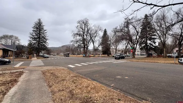 a view of road with with cars