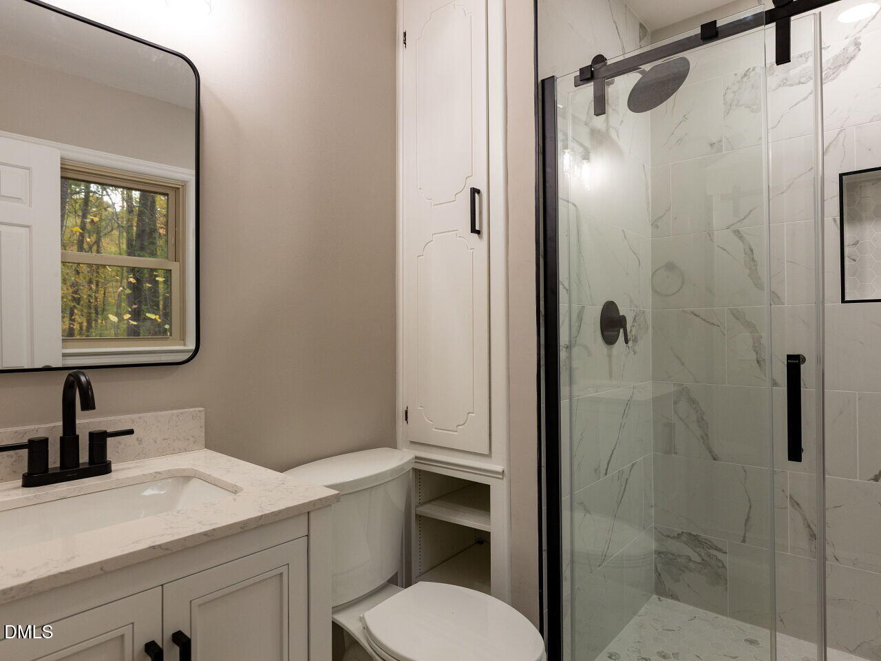 4800 Theys Road Raleigh, NC 27606 - Photo 20 of 43 a bathroom with a sink a toilet and shower