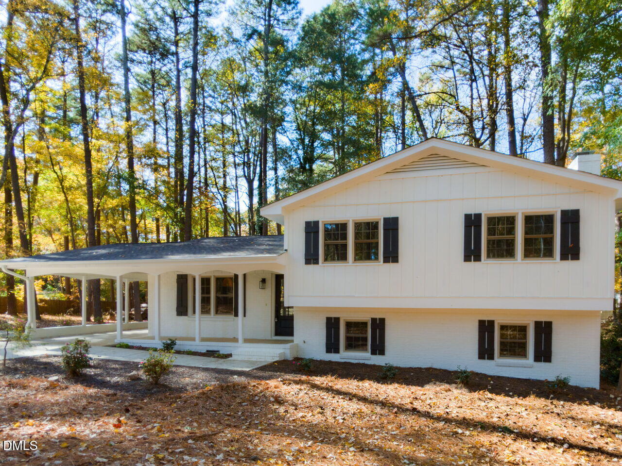 4800 Theys Road Raleigh, NC 27606 - Photo 2 of 43 a house with trees in the background