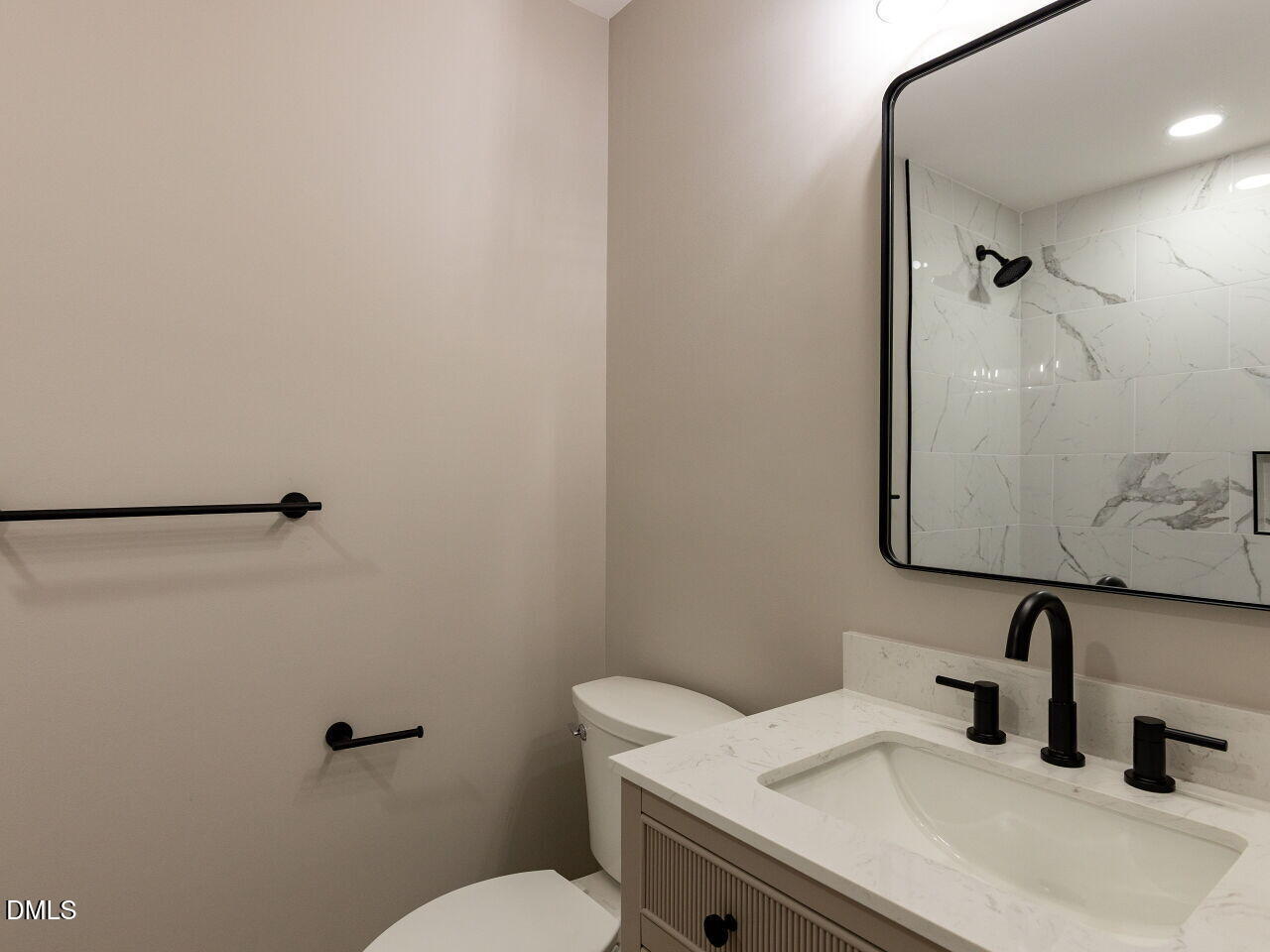 4800 Theys Road Raleigh, NC 27606 - Photo 21 of 43 a bathroom with a sink and a toilet