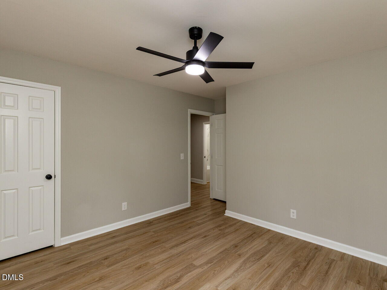 4800 Theys Road Raleigh, NC 27606 - Photo 23 of 43 a view of an empty room with wooden floor