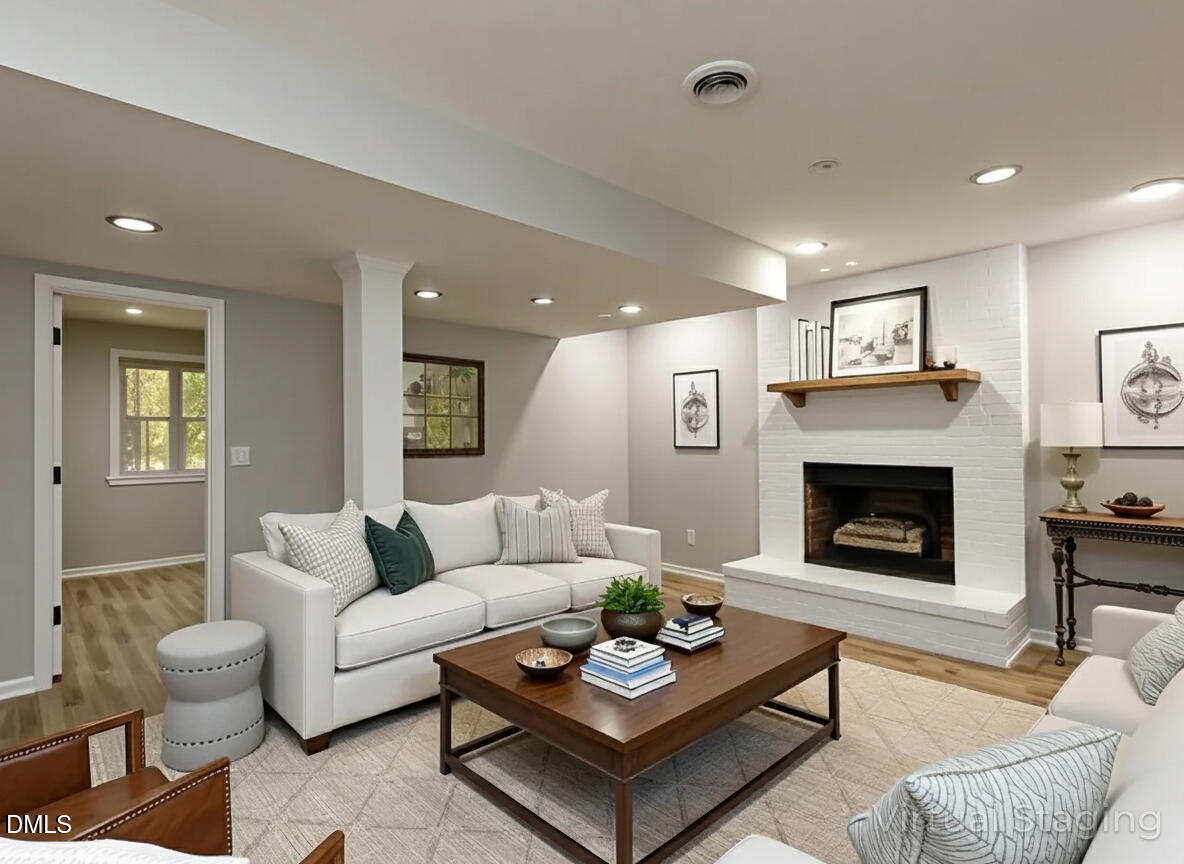 4800 Theys Road Raleigh, NC 27606 - Photo 27 of 43 a living room with furniture and a fireplace
