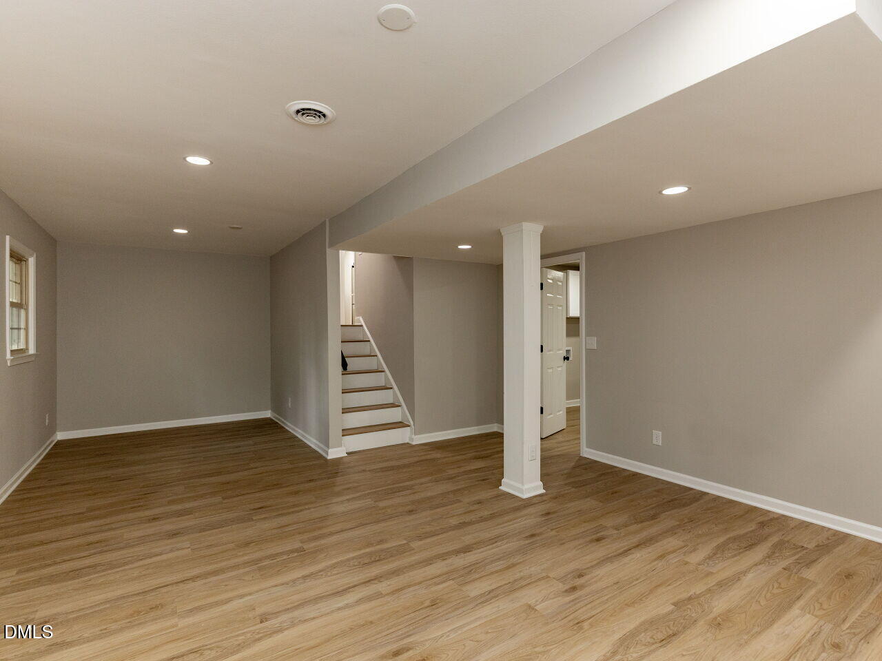 4800 Theys Road Raleigh, NC 27606 - Photo 30 of 43 a view of empty room with wooden floor and window
