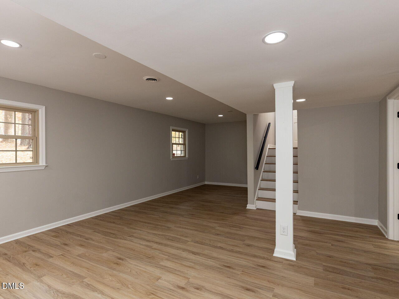 4800 Theys Road Raleigh, NC 27606 - Photo 31 of 43 wooden floor and windows in an empty room