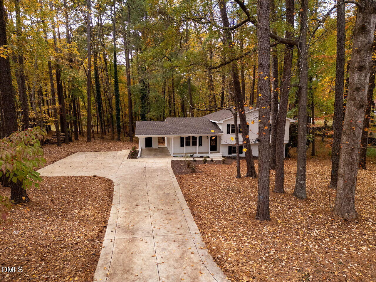 4800 Theys Road Raleigh, NC 27606 - Photo 5 of 43 a house with trees in front of it