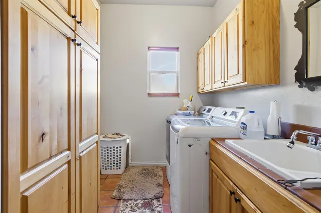 a view of bathroom with dual sinks