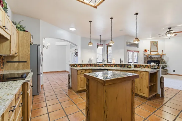 a kitchen with a sink a counter top space and stainless steel appliances
