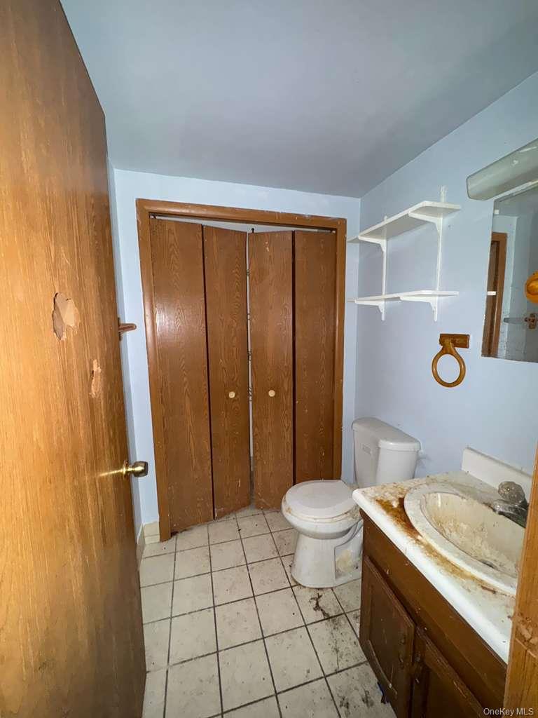 2028 Story Avenue Bronx, NY 10473 - Photo 16 of 16 Bathroom with vanity and light tile patterned floors