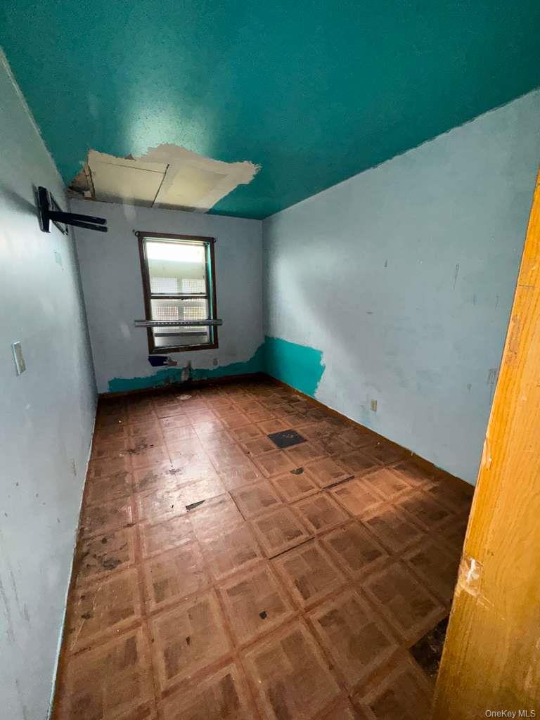 2028 Story Avenue Bronx, NY 10473 - Photo 6 of 16 Empty room featuring tile patterned floors