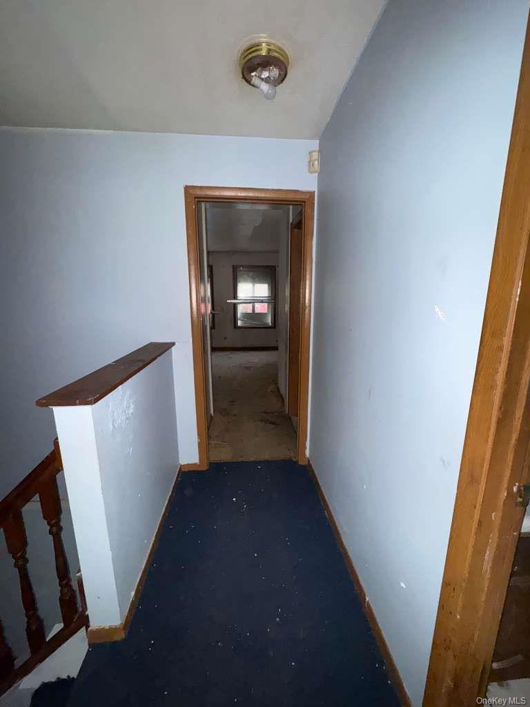 2028 Story Avenue Bronx, NY 10473 - Photo 7 of 16 Corridor with baseboards and an upstairs landing