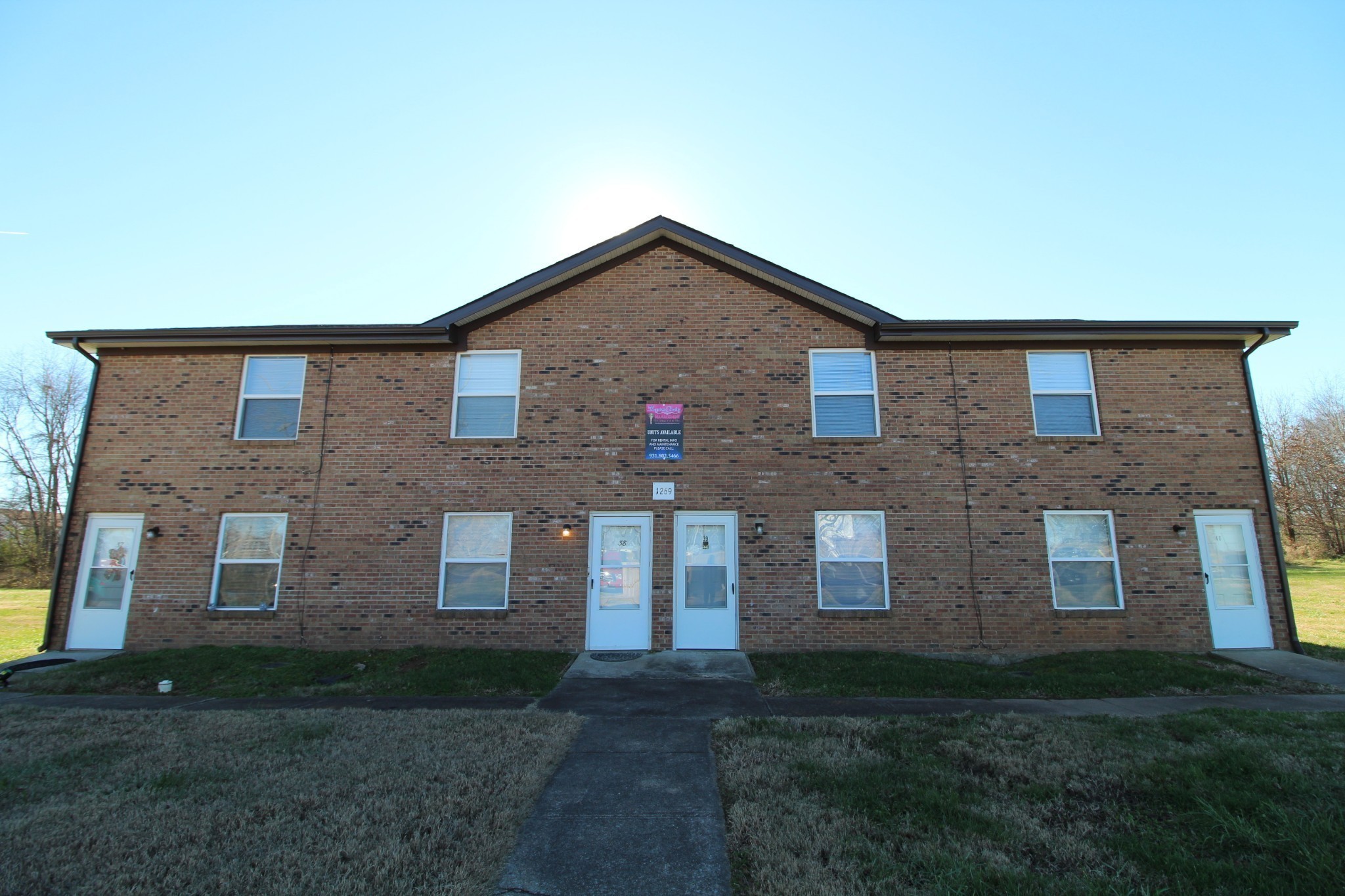 1269 State Line Road, Unit 40 Oak Grove, KY 42262 - Photo 1 of 6 a front view of a house with garden