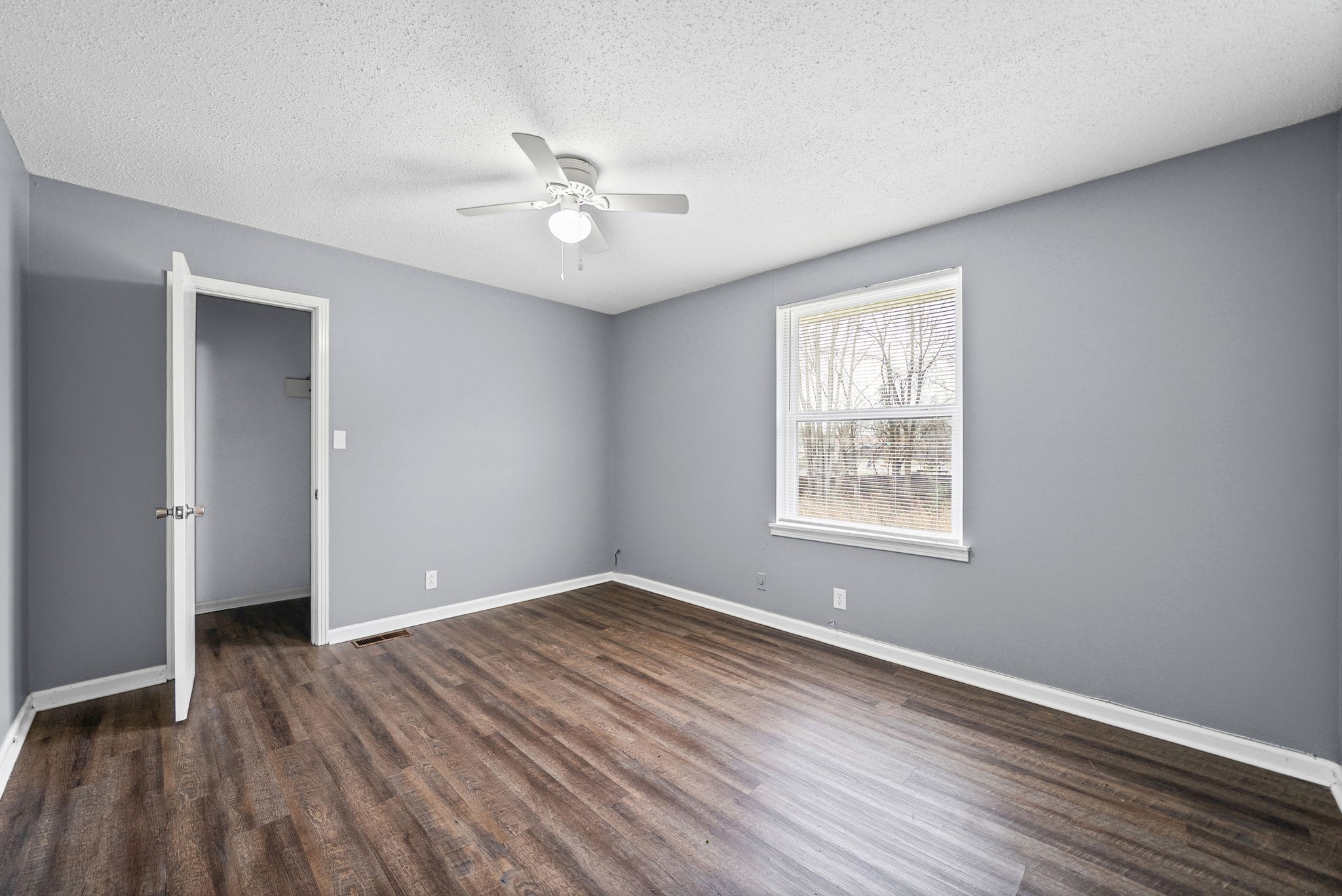 1269 State Line Road, Unit 40 Oak Grove, KY 42262 - Photo 12 of 16 a view of an empty room with wooden floor and a window
