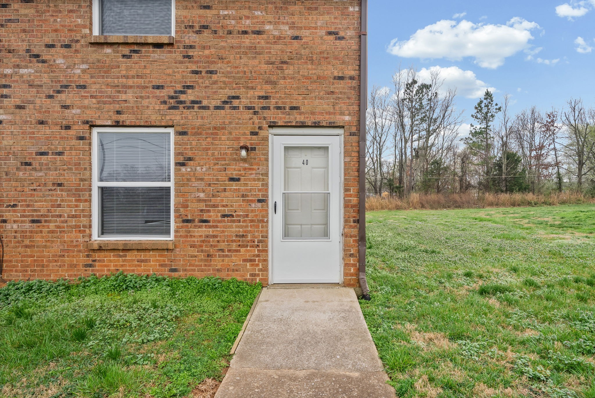 1269 State Line Road, Unit 40 Oak Grove, KY 42262 - Photo 2 of 16 a view of a back yard of the house