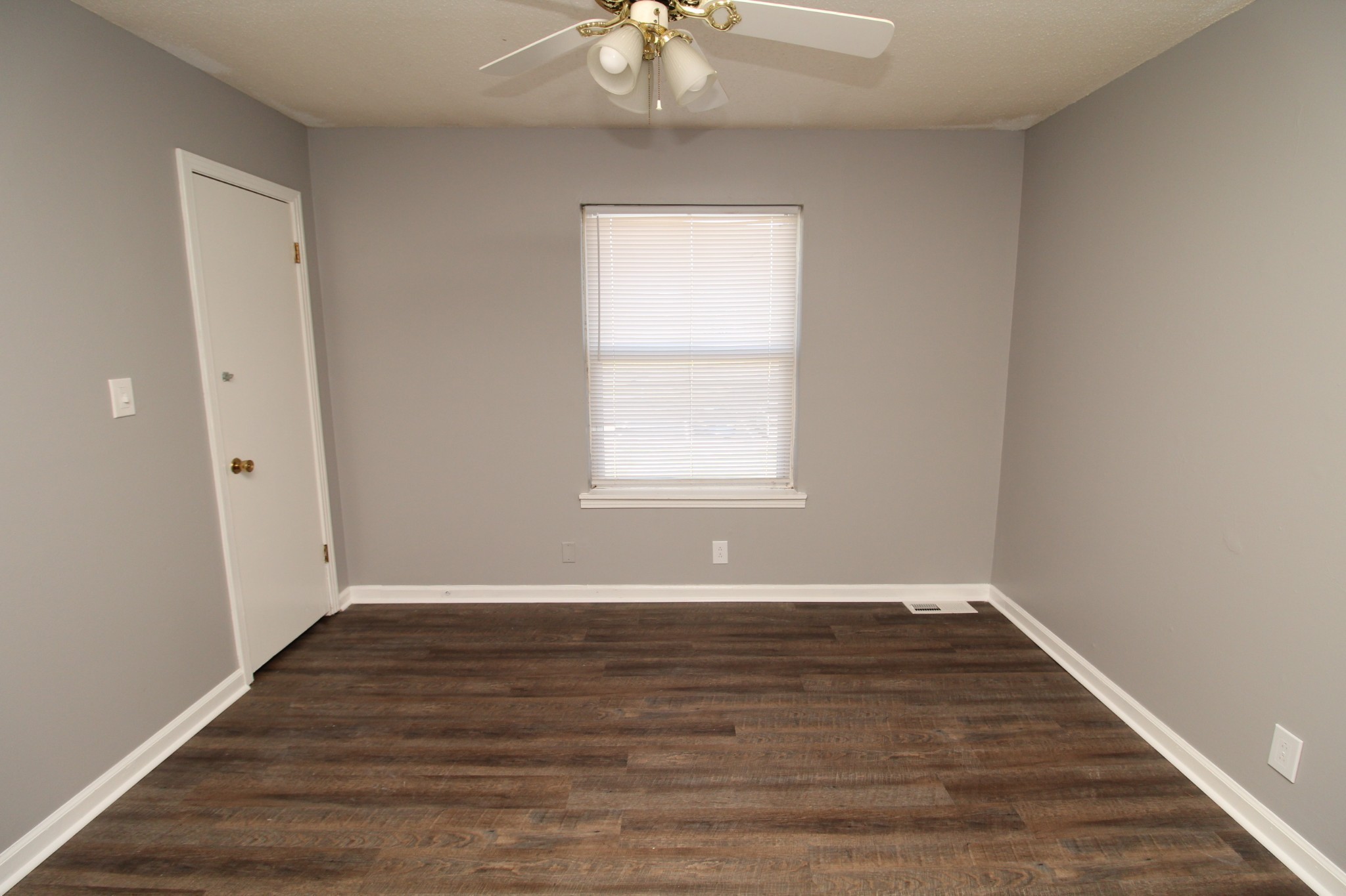1269 State Line Road, Unit 40 Oak Grove, KY 42262 - Photo 6 of 6 a view of an empty room with wooden floor and a window