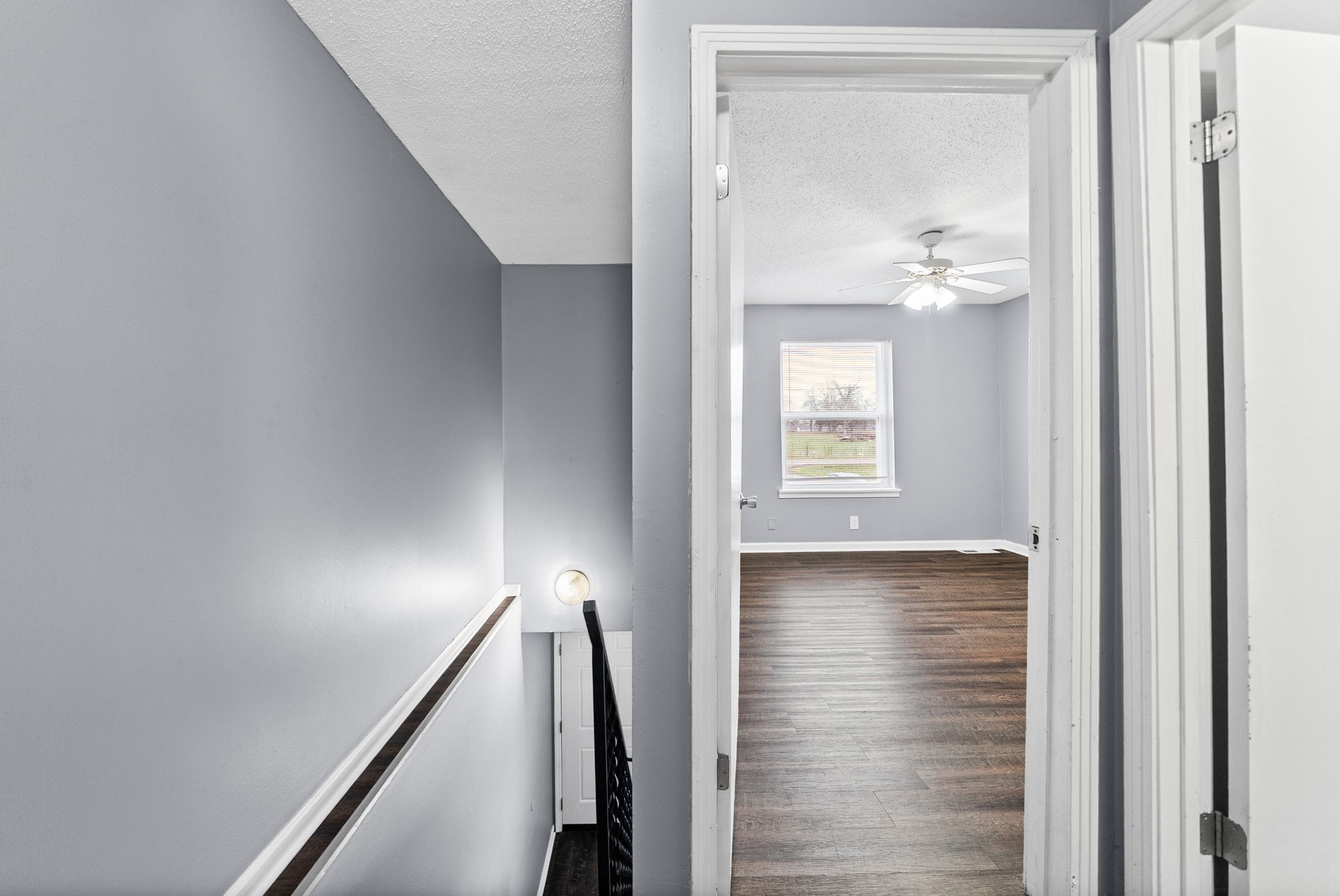 1269 State Line Road, Unit 40 Oak Grove, KY 42262 - Photo 8 of 16 a view of a hallway with wooden floor and staircase
