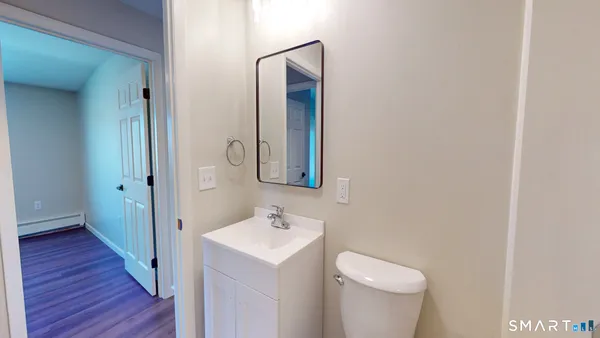 a bathroom with a sink and mirror