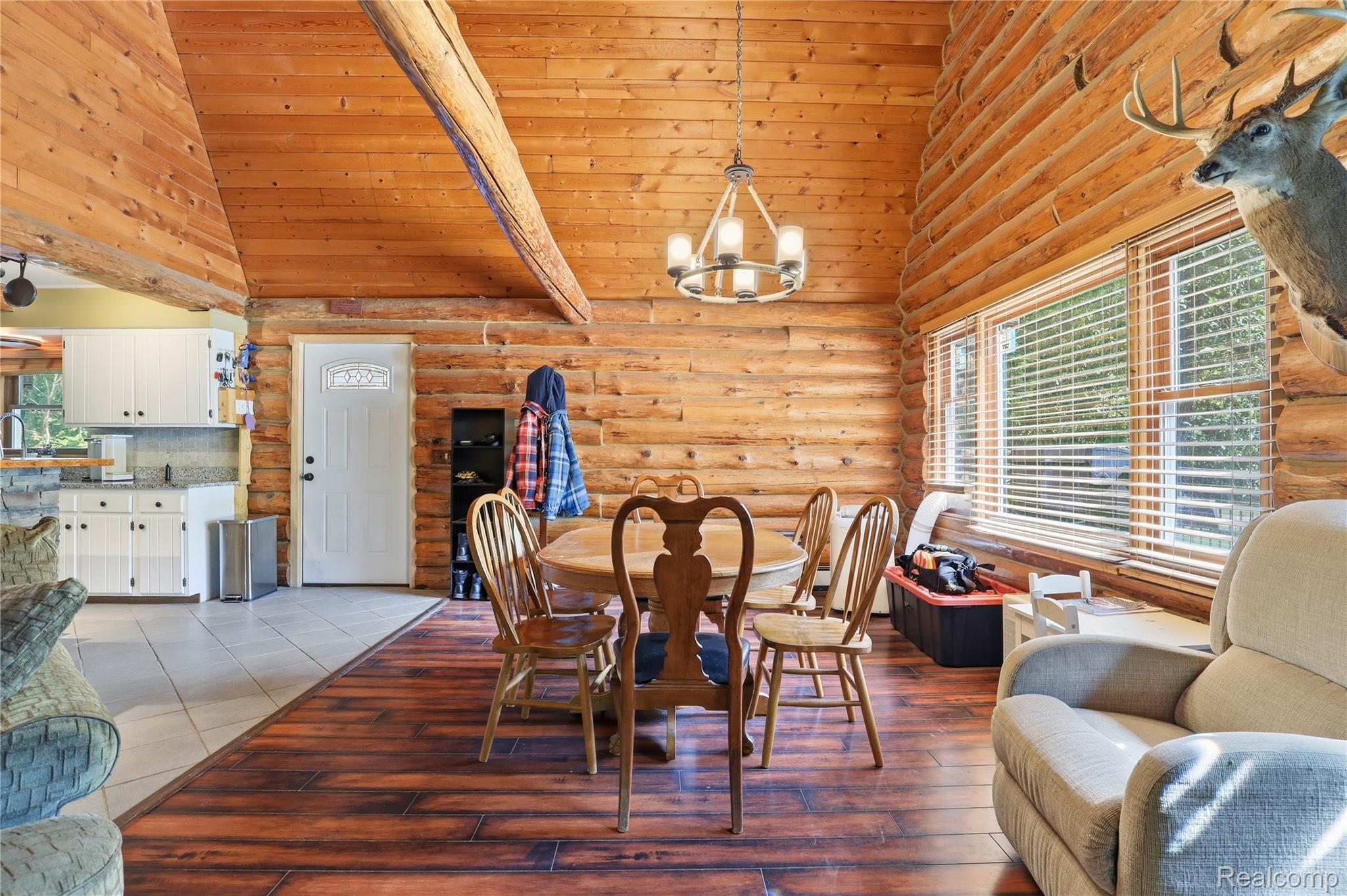 14830 Sheridan Road Byron, MI 48418 - Photo 10 of 74 Vaulted wood-paneled ceilings over an open-concept dining space