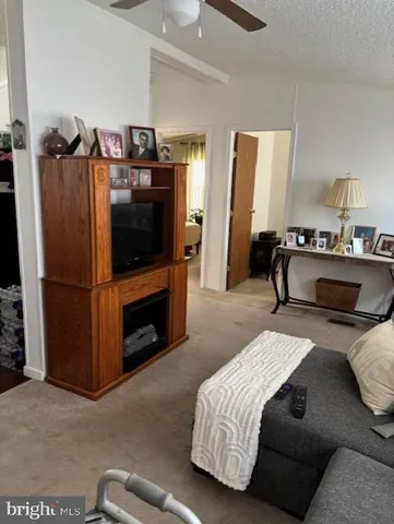 a bedroom with a bed and a television