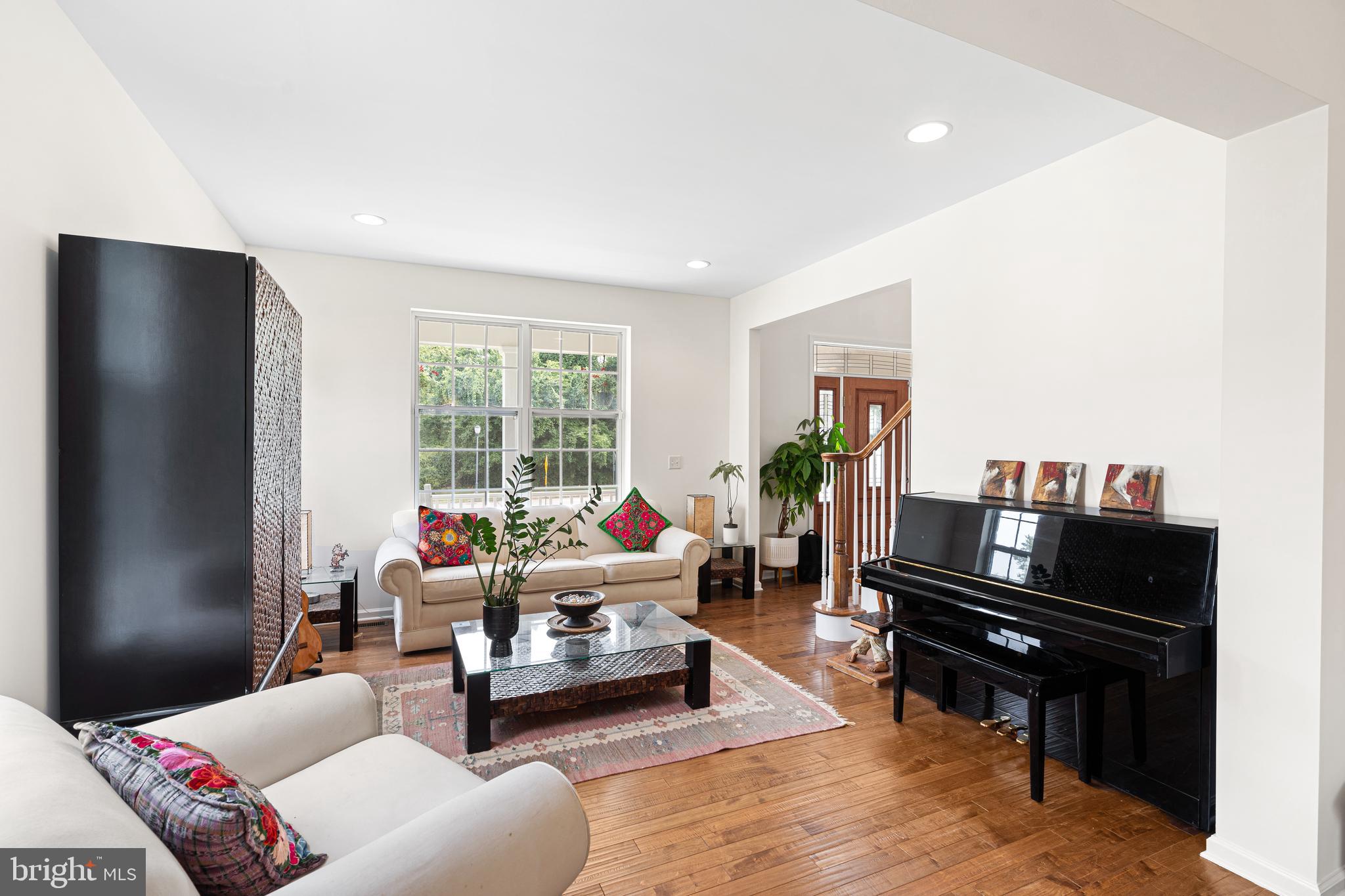 39 Brandon Road West Pennington, NJ 08534 - Photo 23 of 48 a living room with furniture and a piano