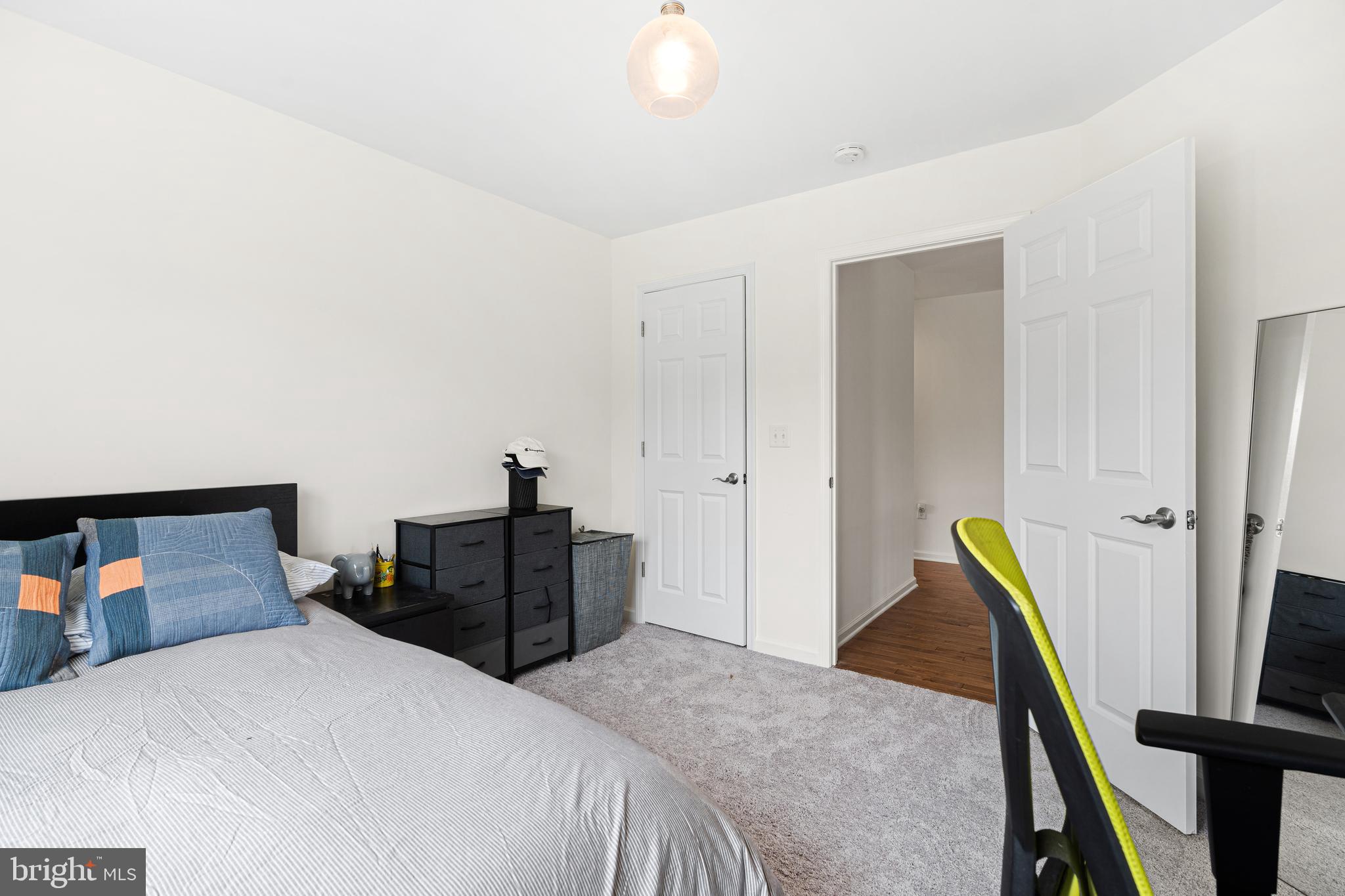 39 Brandon Road West Pennington, NJ 08534 - Photo 32 of 48 a bedroom with a bed and wooden floor