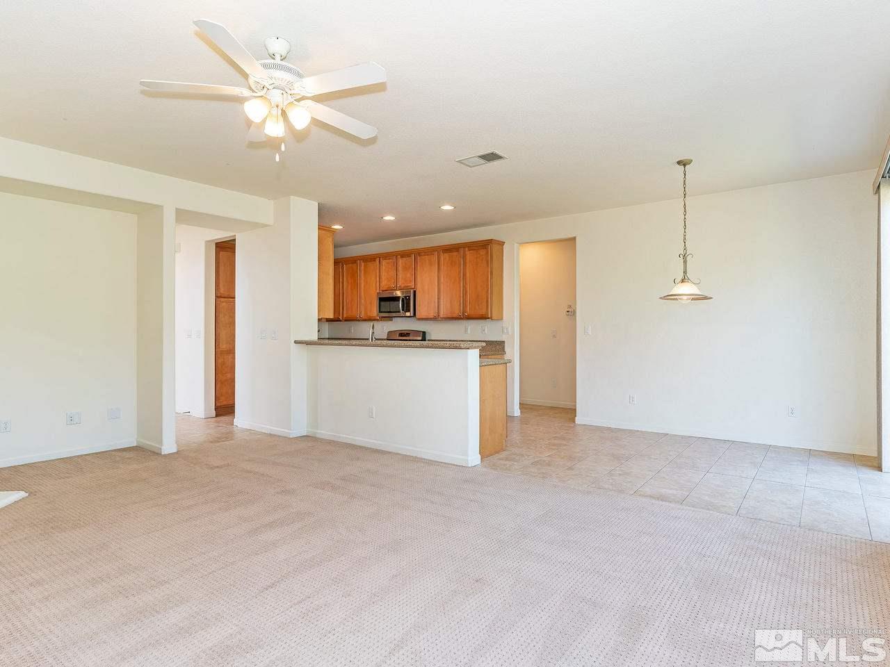 13665 Dressage Court Reno, NV 89521 - Photo 8 of 22 a view of a kitchen with a sink and a kitchen