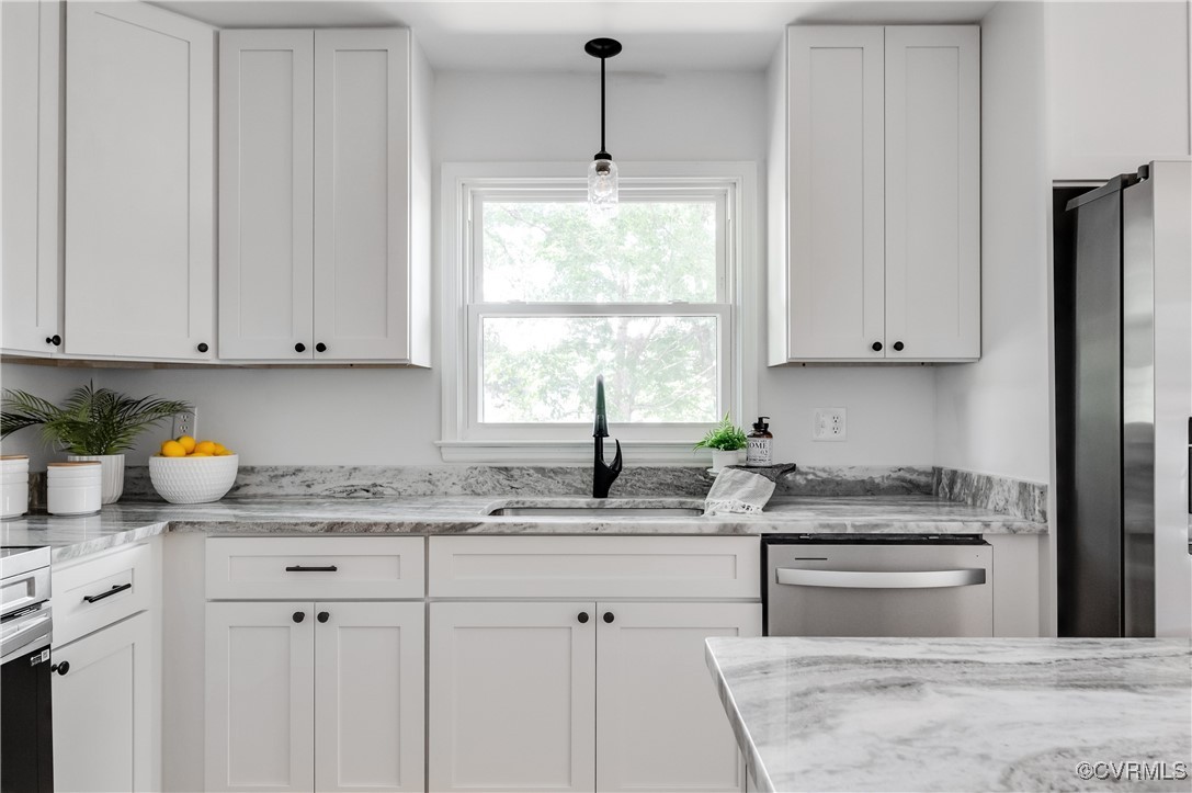 2840 Osborne Road Chester, VA 23831 - Photo 14 of 42 a kitchen with granite countertop a sink window and cabinets