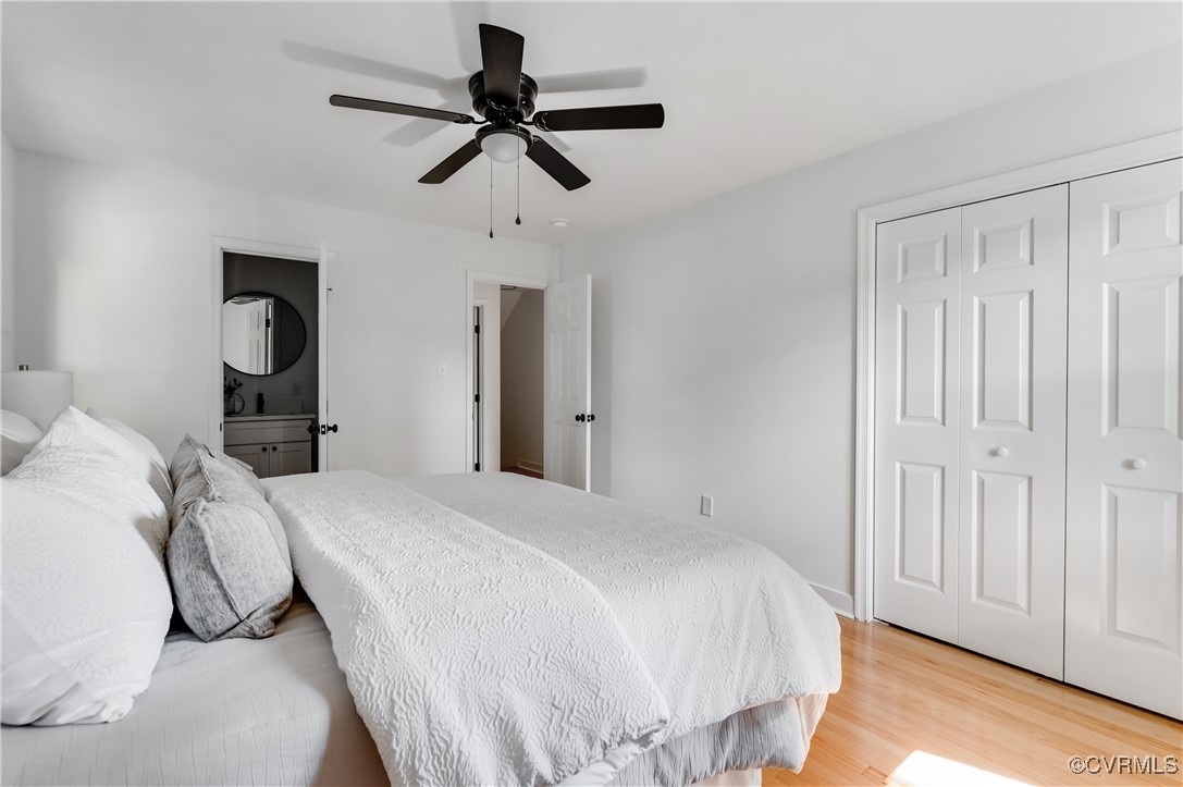 2840 Osborne Road Chester, VA 23831 - Photo 26 of 42 a bedroom with a bed and a chandelier