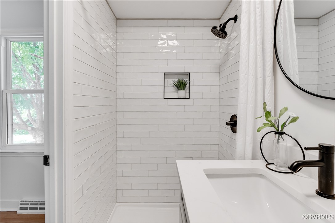 2840 Osborne Road Chester, VA 23831 - Photo 28 of 42 a bathroom with a sink a mirror and a shower