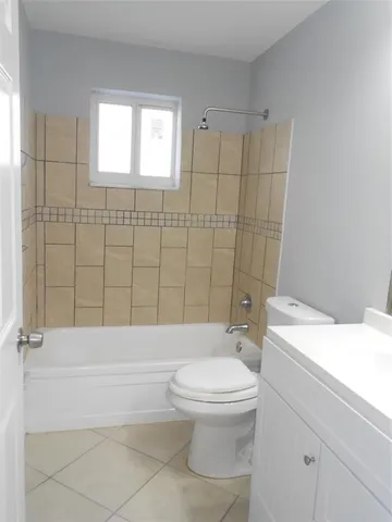 a bathroom with a toilet a sink and a shower