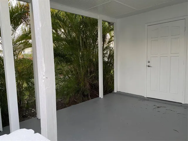 a view of a room with a small yard