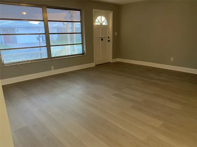 a view of an empty room with a window