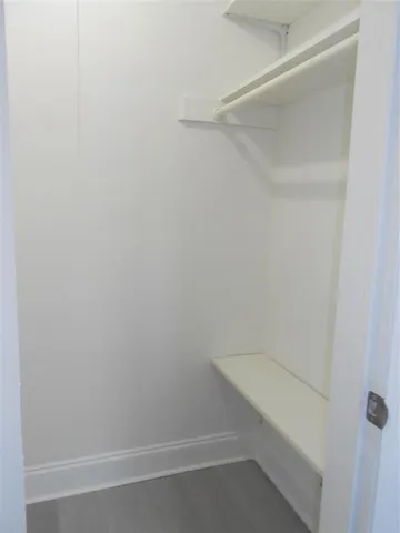 a view of an empty walk in closet