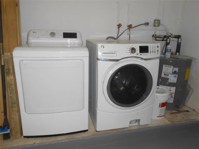 a utility room with dryer and washer