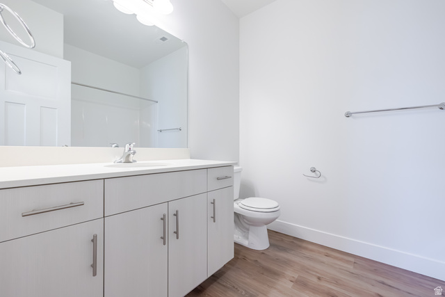693 West 4500th South, Unit O301 Mapleton, UT 84664 - Photo 6 of 16 Bathroom with vanity, light wood finished floors, and a shower